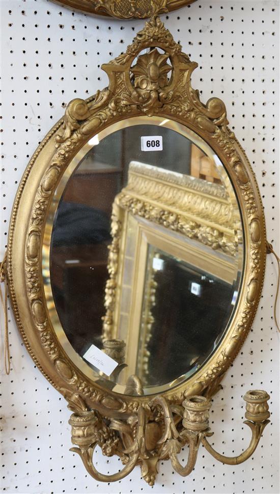 Oval gilt wall mirror